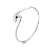 A studio shot of a shiny, silver bangle with a smooth, curving wave design, presented on a white background.