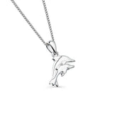A sterling silver pendant necklace featuring two textured dolphins swimming together, suspended on a fine silver chain, on a white background.