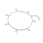 A sterling silver charm anklet featuring multiple small daisies with gold-plated centres, on a white background.