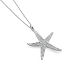 A sterling silver pendant necklace featuring a detailed, textured starfish charm suspended on a fine silver chain, on a white background.