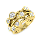 A wide multi-band diamond bubble ring in 9ct yellow gold, featuring multiple bezel-set diamonds of various sizes, on a white background.