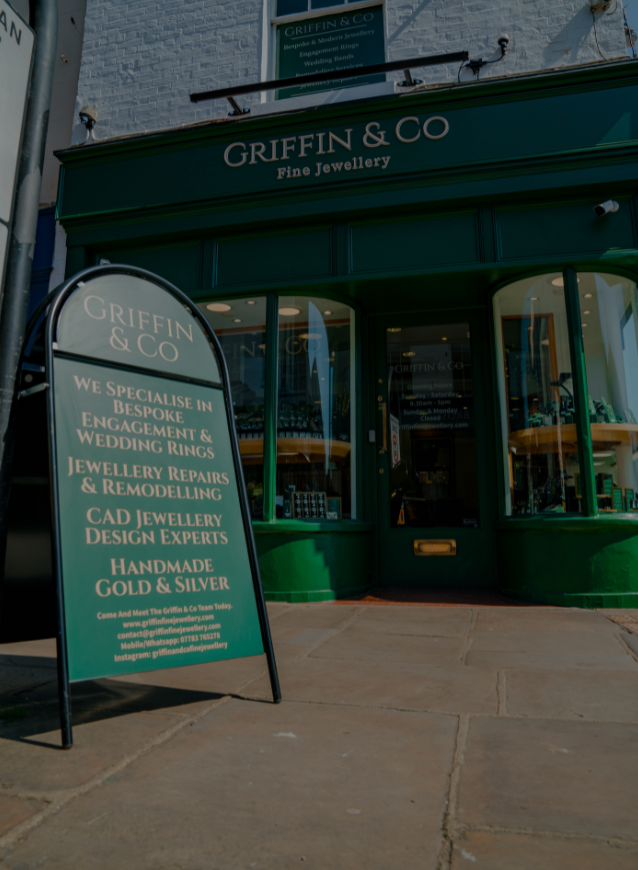 Griffin & Co Fine Jewellery storefront with a sign providing contact information for bespoke services and repairs.