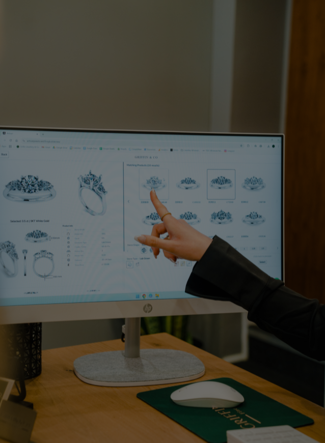 A close-up of a computer screen displaying engagement ring designs being reviewed at Griffin & Co, highlighting the options for creating a bespoke ring.