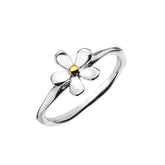 A two-tone daisy ring with sterling silver petals and a brass centre, shown on a white background.