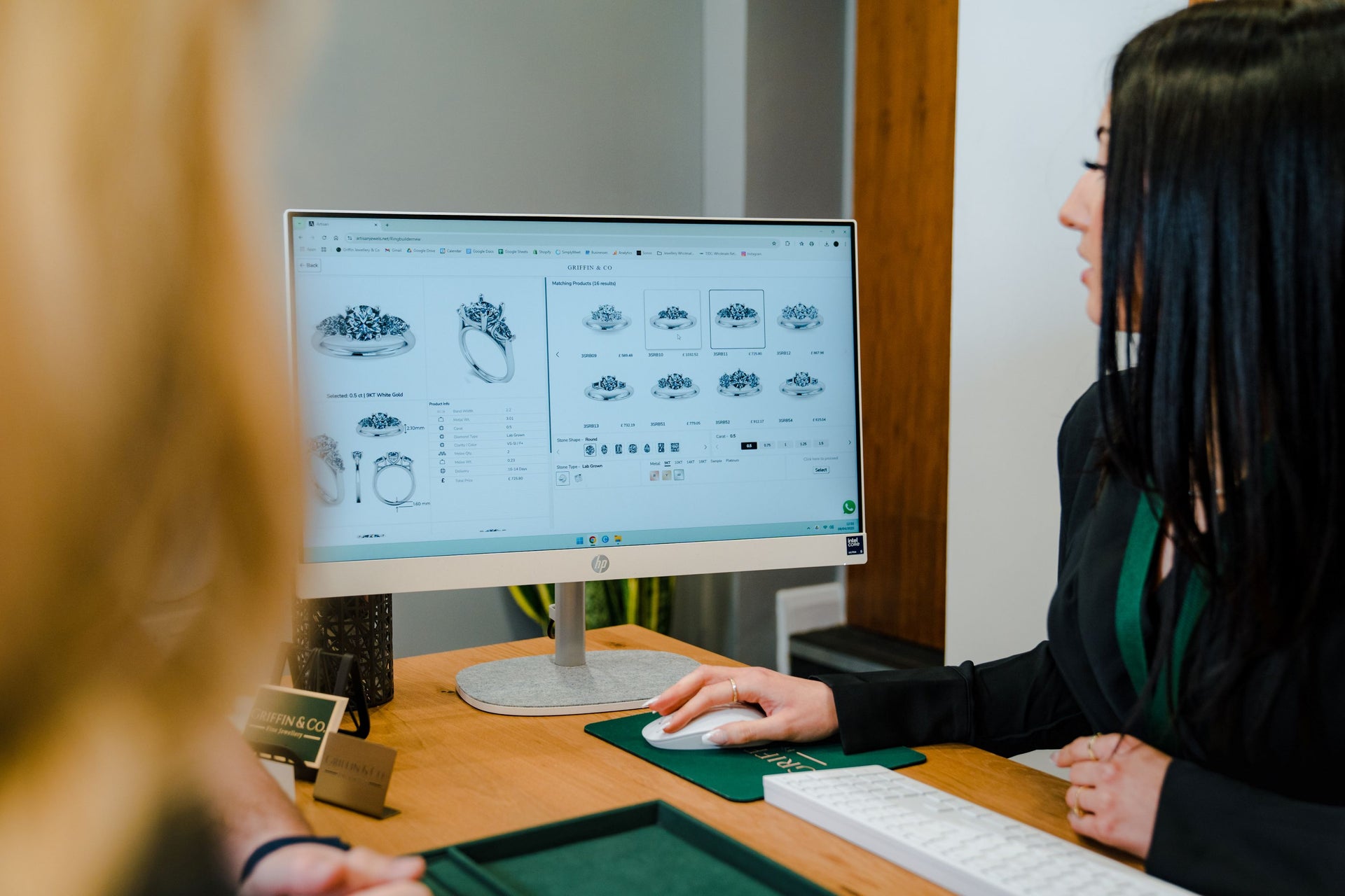 Exploring options for customised engagement ring designs on a computer screen at Griffin & Co Fine Jewellery.