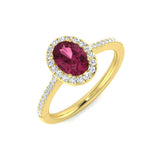 An oval pink tourmaline and diamond halo engagement ring, crafted in 9ct yellow gold, on a white background.