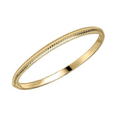 A single gold-plated hinged bangle with a textured, striped coil design, shown on a white background.