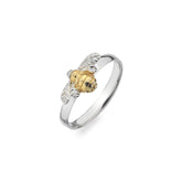 Two-tone ring with gold and silver design on a white background