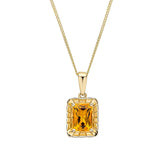 A 9ct yellow gold pendant featuring an octagon-cut citrine gemstone surrounded by a detailed, textured gold frame, shown on a fine gold chain.