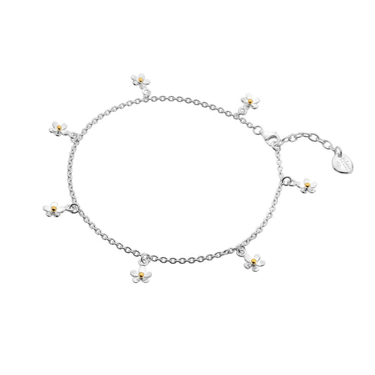 A sterling silver charm anklet featuring multiple small daisies with gold-plated centres, on a white background. 1800