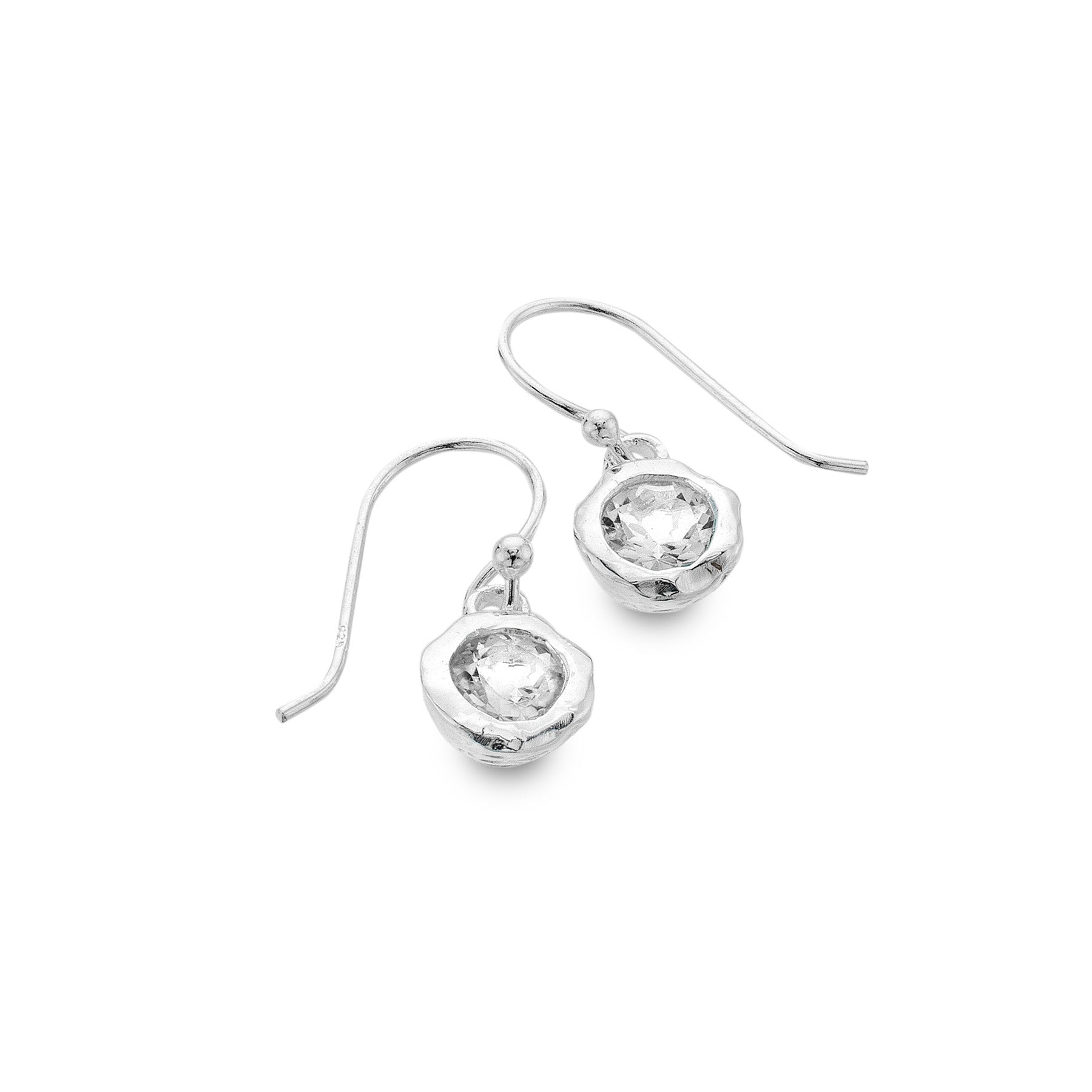 A pair of sterling silver drop earrings with a textured organic surround holding a faceted white topaz stone, on hook wires.