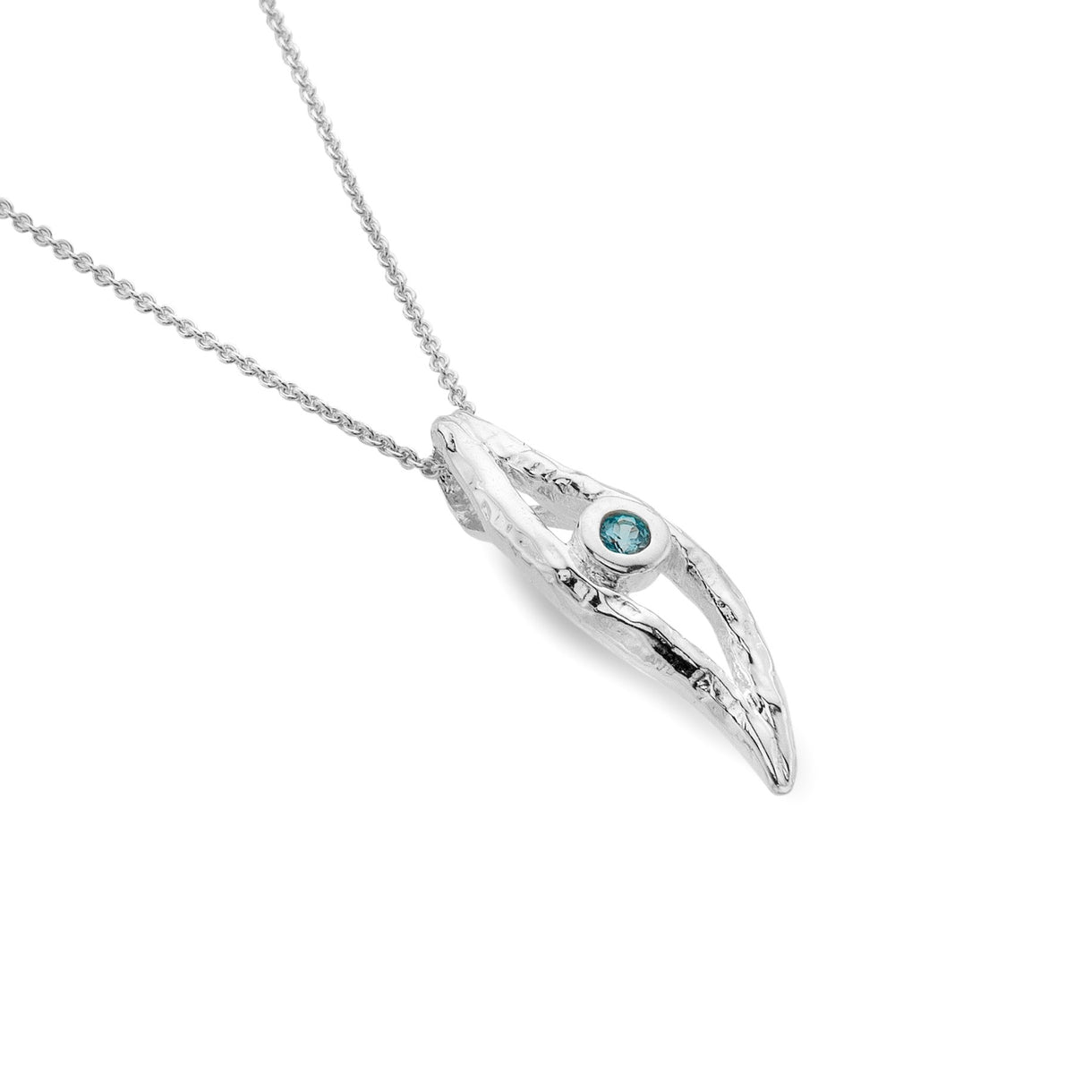 A sterling silver pendant necklace featuring an elongated, textured organic wave shape set with a round blue topaz gemstone, on a silver chain.
