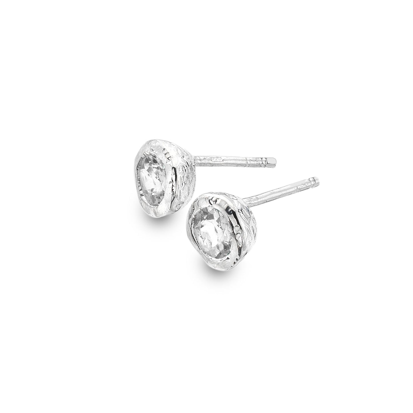 A pair of chunky, textured sterling silver stud earrings set with faceted white topaz stones, shown on a white background.