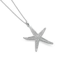 A sterling silver pendant necklace featuring a detailed, textured starfish charm suspended on a fine silver chain, on a white background.