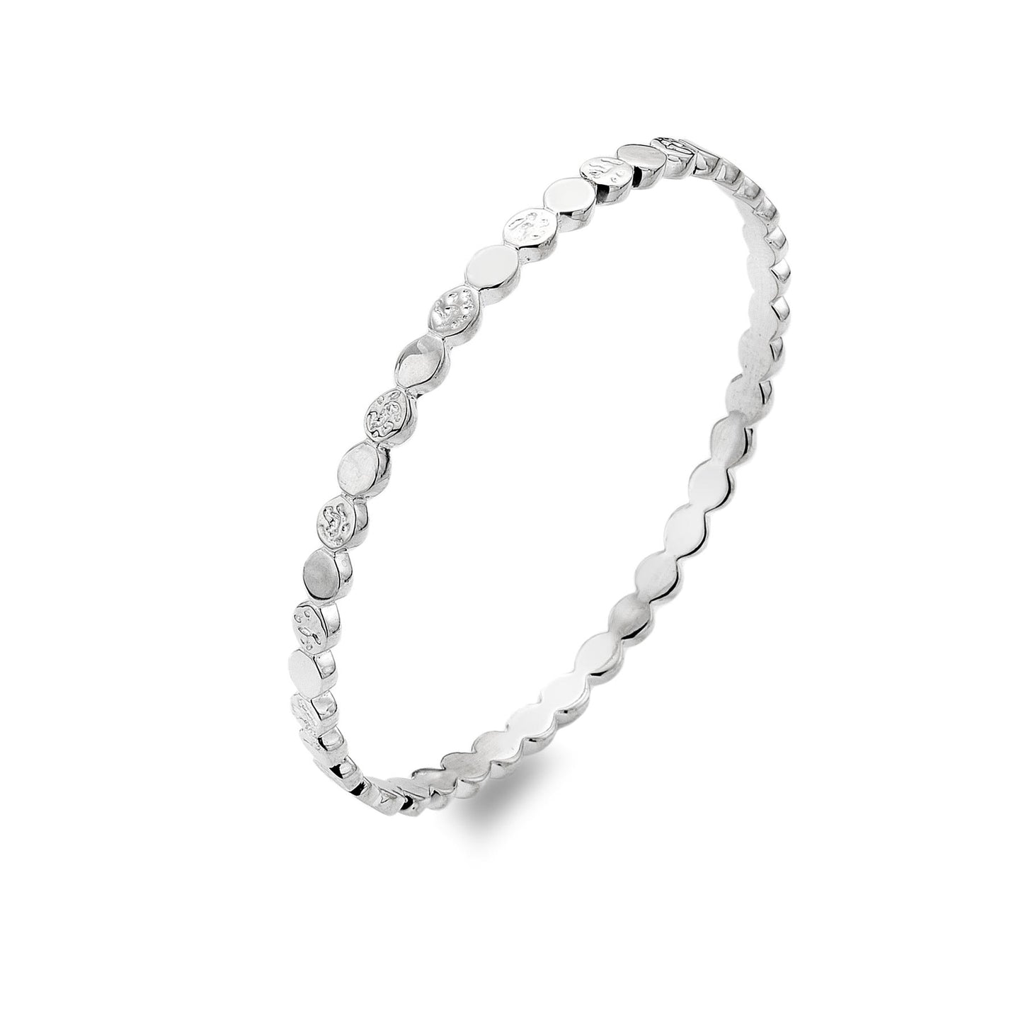 A studio shot of a shiny silver bangle with a repeating pattern of round, flat discs. Some discs are smooth, and others have a hammered texture.