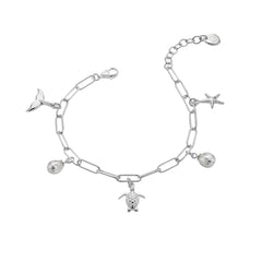 A sterling silver charm bracelet on a paperclip chain, featuring turtle, starfish, and whale tail charms interspersed with freshwater pearls, on a white background.