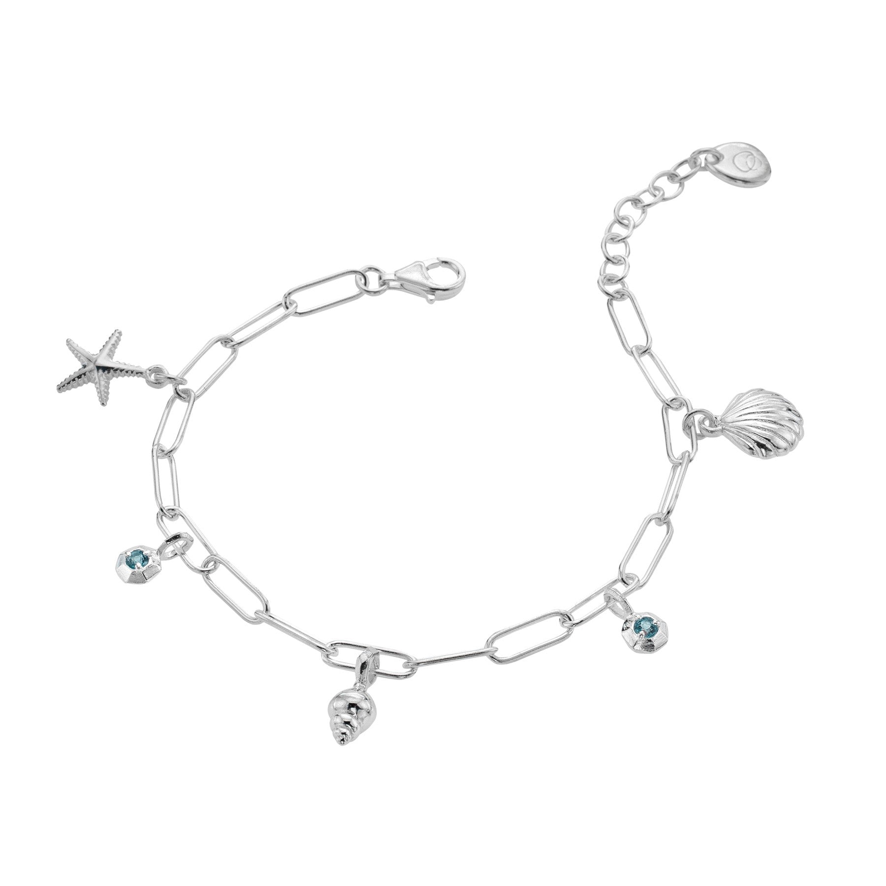 A sterling silver charm bracelet on a paperclip chain, featuring starfish and sea shell charms interspersed with blue topaz stones, on a white background.