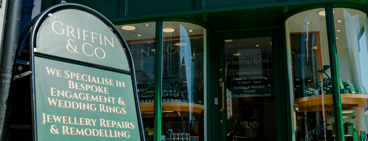 Griffin & Co Fine Jewellery storefront with a sign advertising bespoke services and repairs, suggesting customers contact them for inquiries.