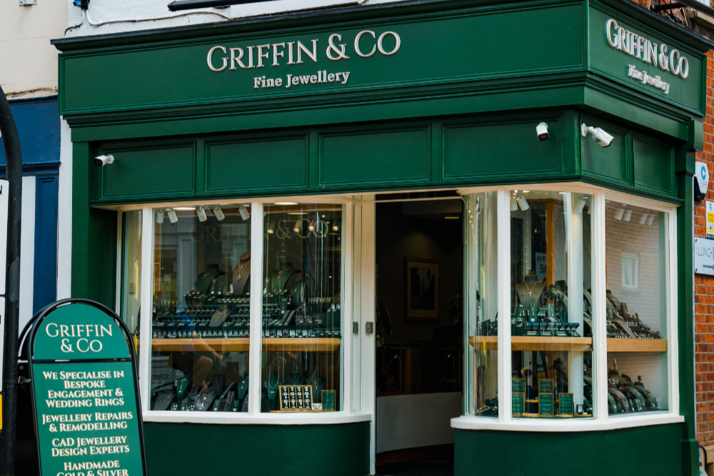 Griffin & Co fine jewellery store front with green facade and glass windows.