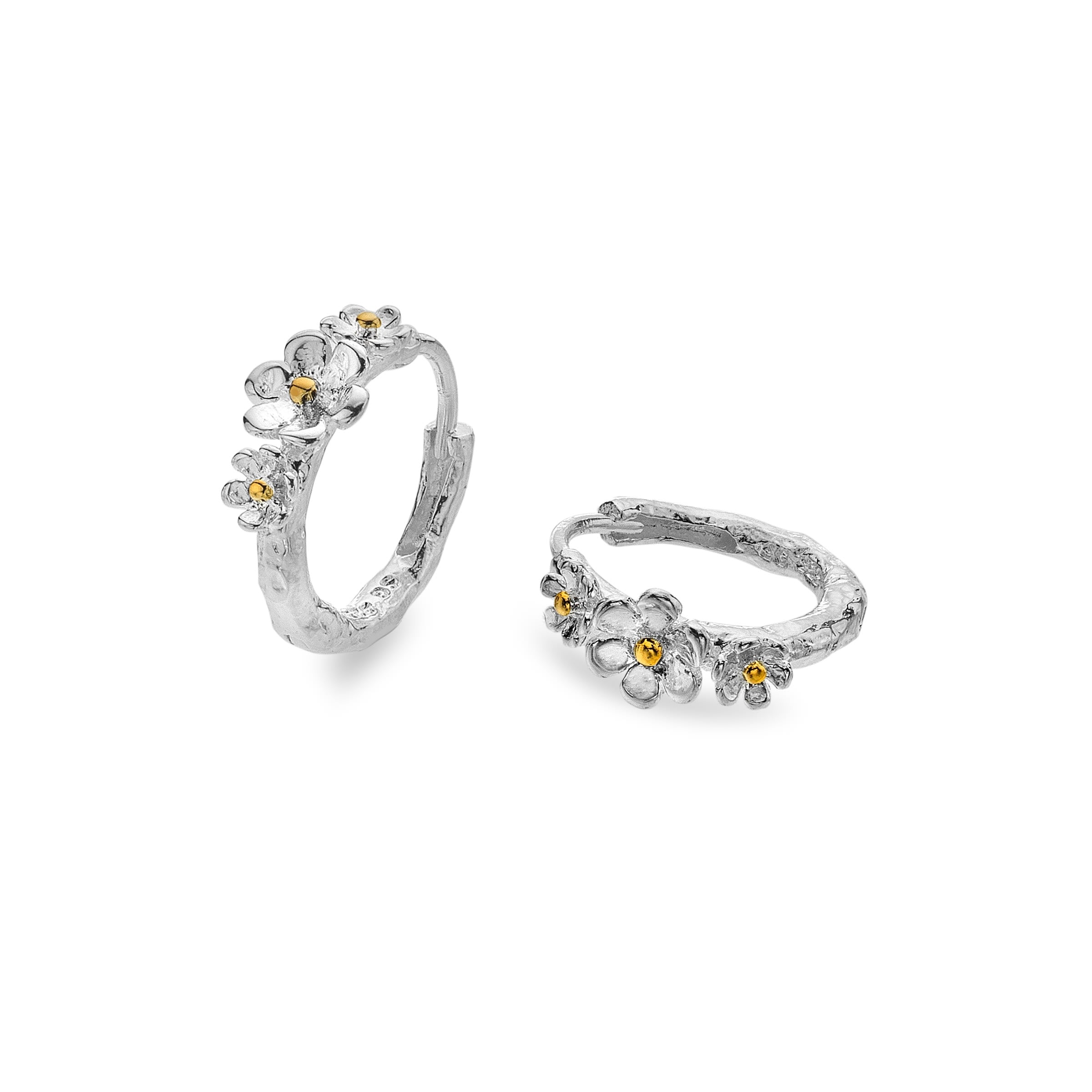 A pair of Silver Origins triple daisy hoop earrings, showing the textured silver hoop and gold vermeil centres, on a white background.