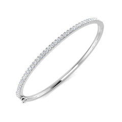 9ct White Gold hinged bangle bracelet featuring a half-set row of round brilliant natural diamonds and a secure clasp mechanism.