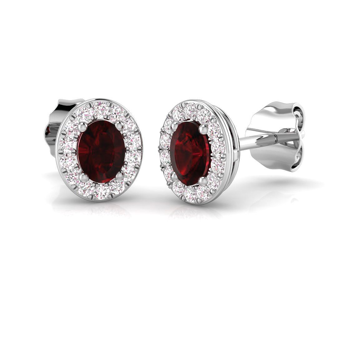 Close-up of 9ct white gold ruby and diamond earring pair