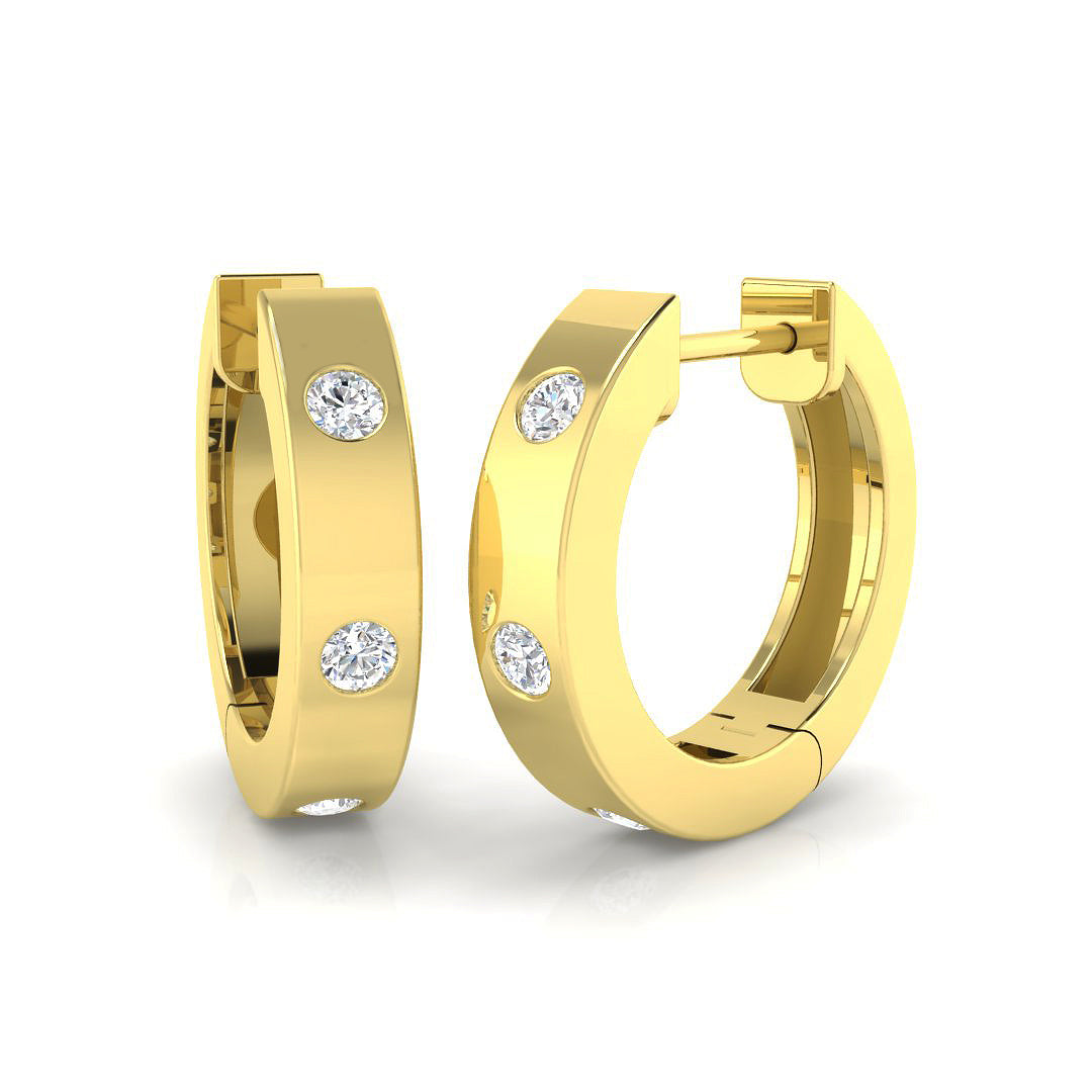 Close-up view of 9ct yellow gold diamond earring detail