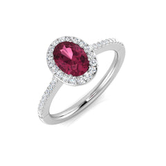 An oval pink tourmaline and diamond halo engagement ring, crafted in 9ct white gold, on a white background.