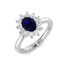 Top view of a 9ct white gold cocktail ring featuring a deep blue oval lab grown sapphire surrounded by a halo of round lab grown diamonds.