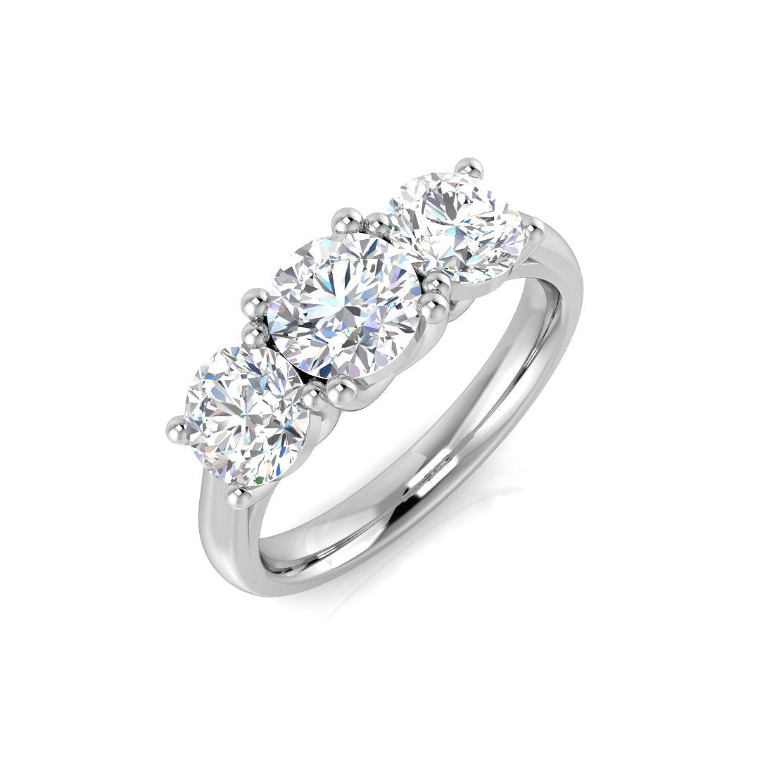 An angled view of a luxurious 18ct white gold trilogy engagement ring, featuring three large round brilliant cut lab grown diamonds totalling 1.95ct.
