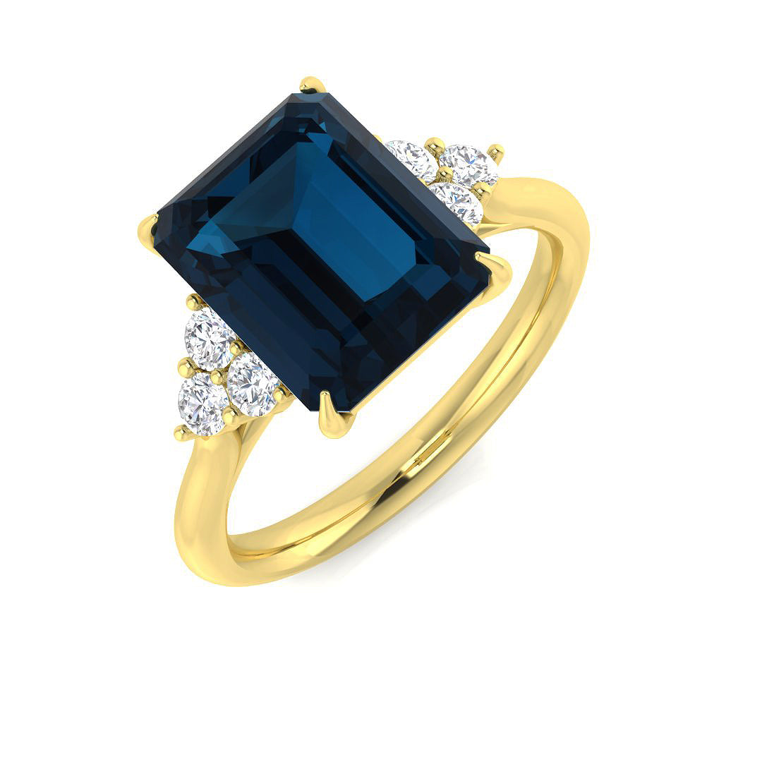 9ct yellow gold London blue topaz ring with diamond setting, front view