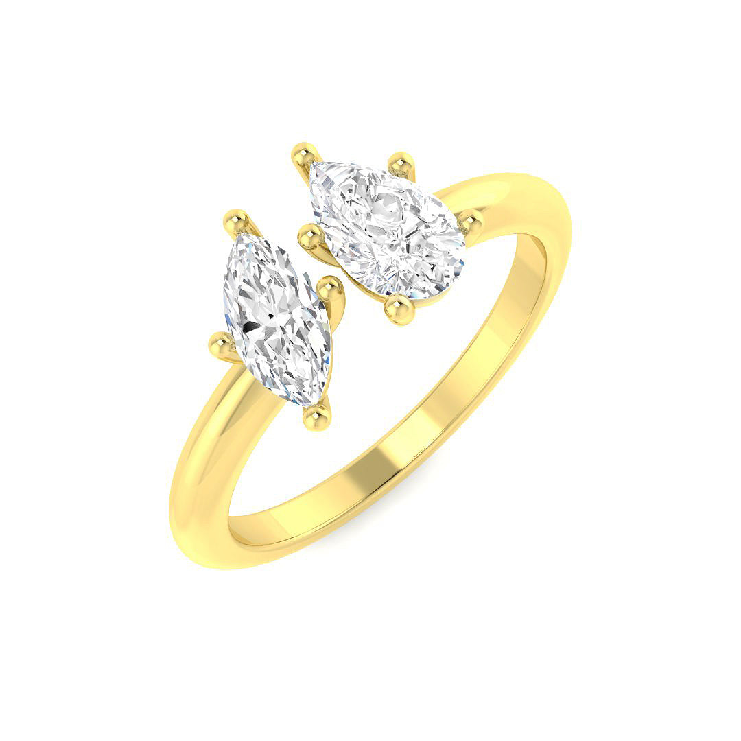 An angled view of an 18ct yellow gold Toi et Moi engagement ring, featuring a pear cut and marquise cut lab grown diamond set side-by-side.