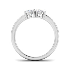 An angled view of an 18ct yellow gold Toi et Moi ring, showcasing a pear diamond and oval diamond duo.