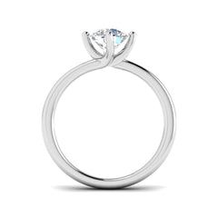 Side profile of a white gold compass set ring showing the elevated setting and polished band.