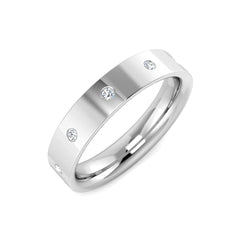 Angled view of a heavyweight platinum wedding band featuring five round lab grown diamonds flush set into the ring.