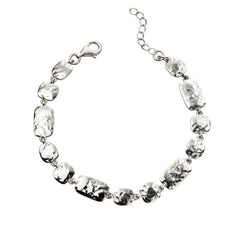 Silver necklace with clear beads on a white background