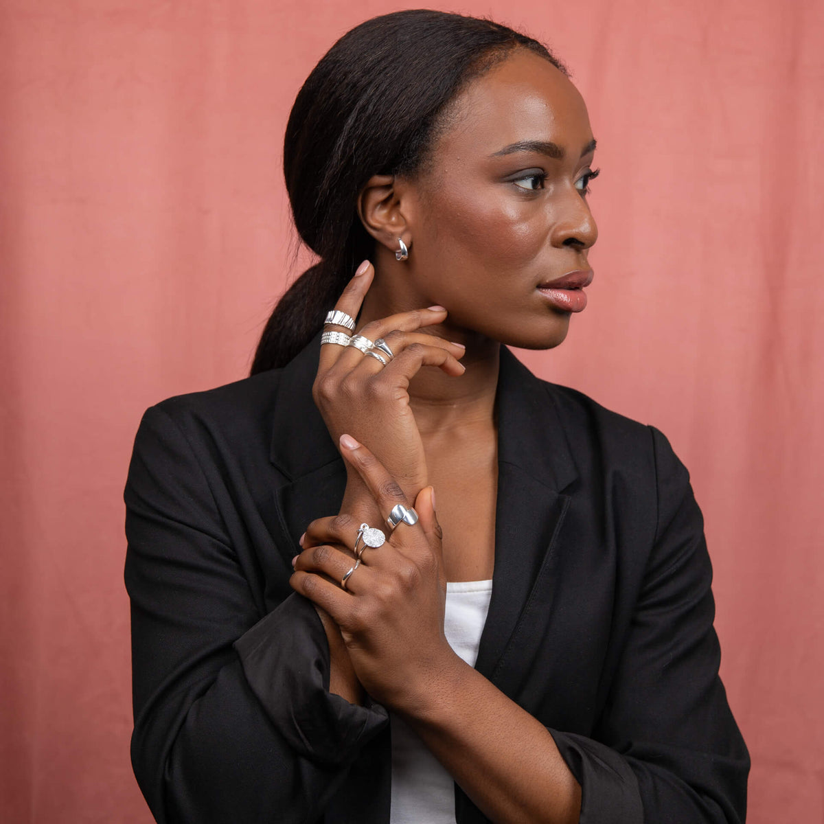 Ripple texture rings worn in silver collection display