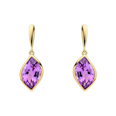 Gold earrings with purple gemstones on a white background