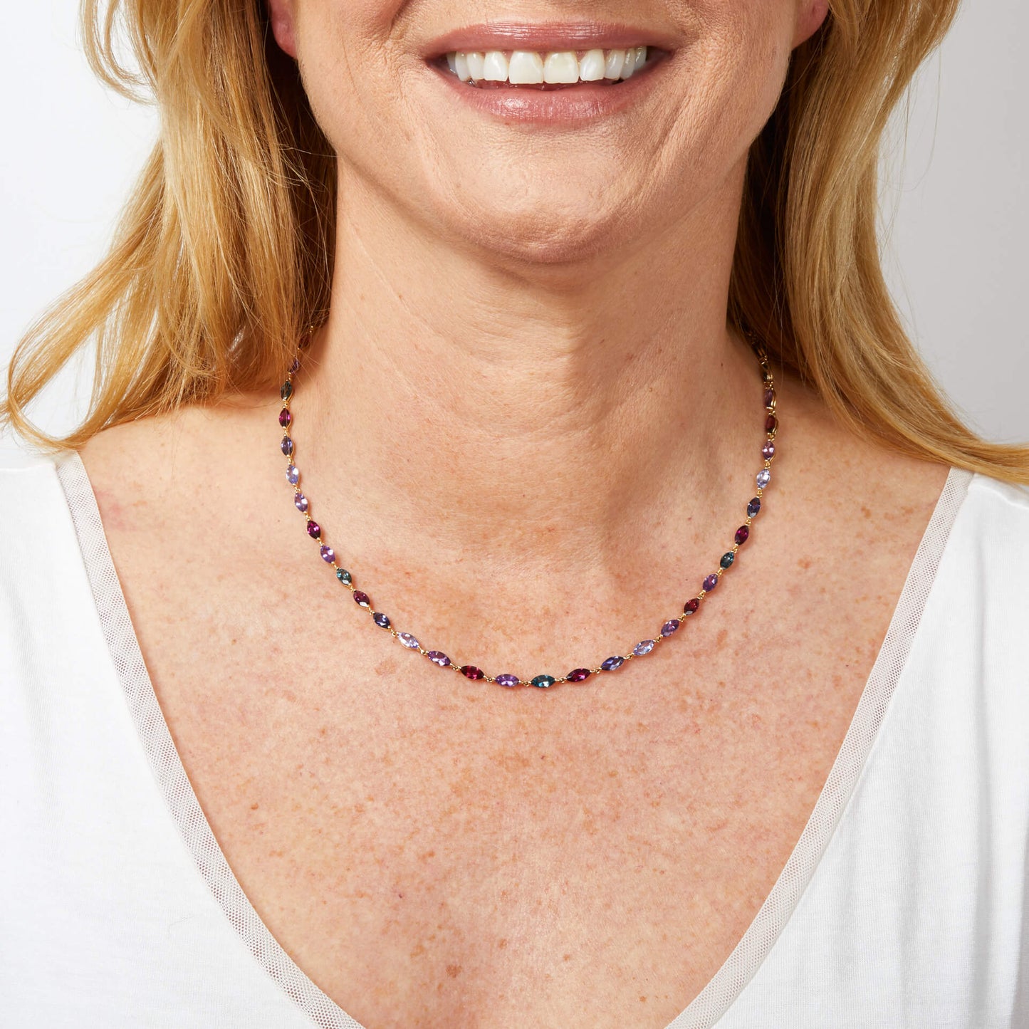 Model wearing the semi-precious navette necklace with rainbow gemstones