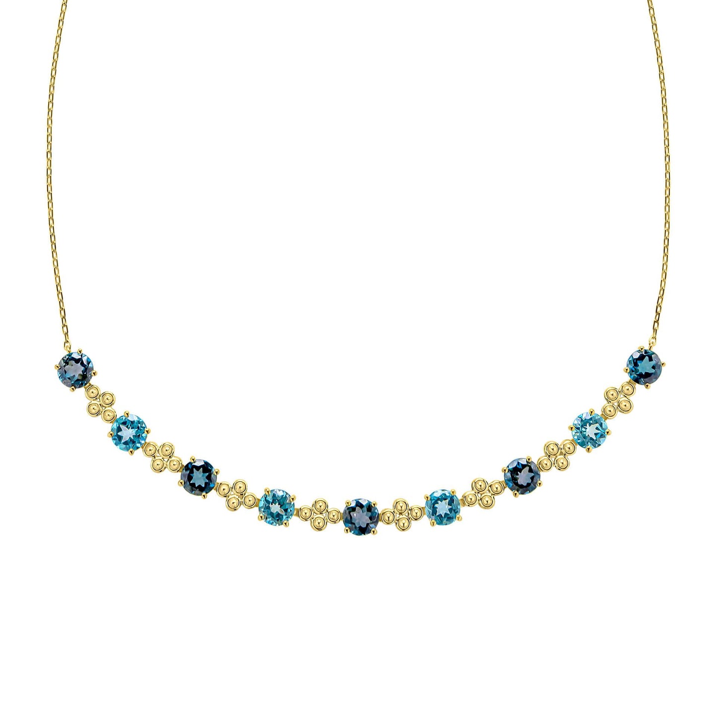 A close-up view of the blue topaz necklace, showing the detailed gold settings and the alternating shades of blue gemstones.