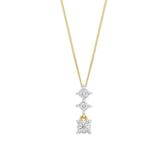 A 9ct yellow gold pendant featuring three vertically stacked diamonds in white gold illusion settings, shown on a fine gold chain.