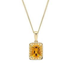 A 9ct yellow gold pendant featuring an octagon-cut citrine gemstone surrounded by a detailed, textured gold frame, shown on a fine gold chain.
