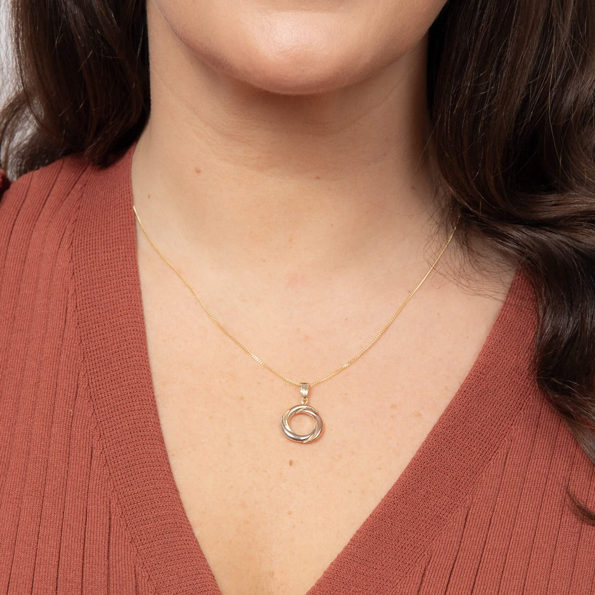 Model wearing tri-metal open circle pendant