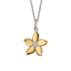 Gold flower-shaped pendant with a diamond on a silver chain against a white background