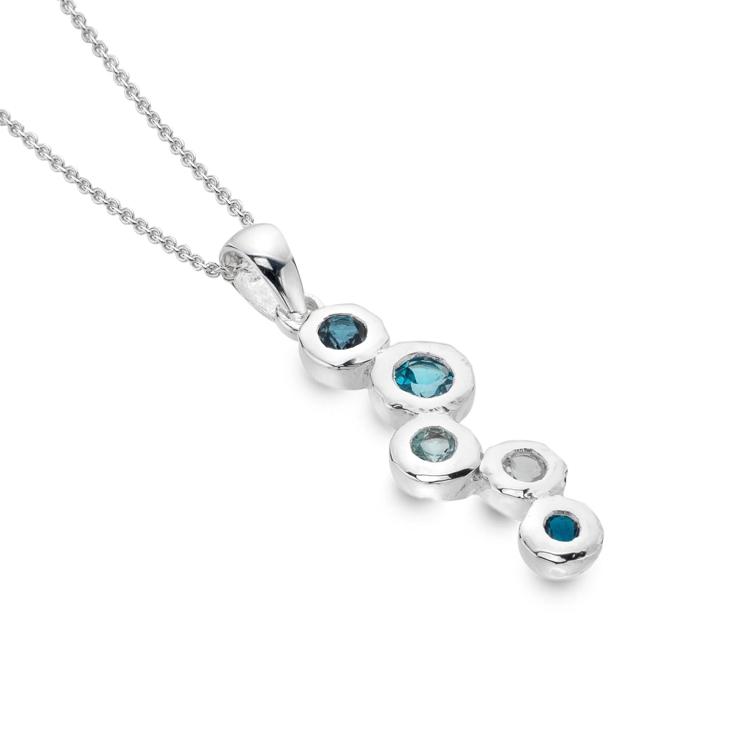 A close-up shot of a polished sterling silver pendant with five different shades of blue and white topaz stones set within it. The pendant is shown against a plain white background.