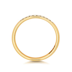 A top-down profile view of a yellow gold channel set wedding band, showing the smooth polished shank.