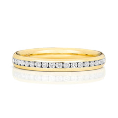 A front view of a 9ct yellow gold diamond eternity ring featuring 50% diamond coverage in a channel setting.