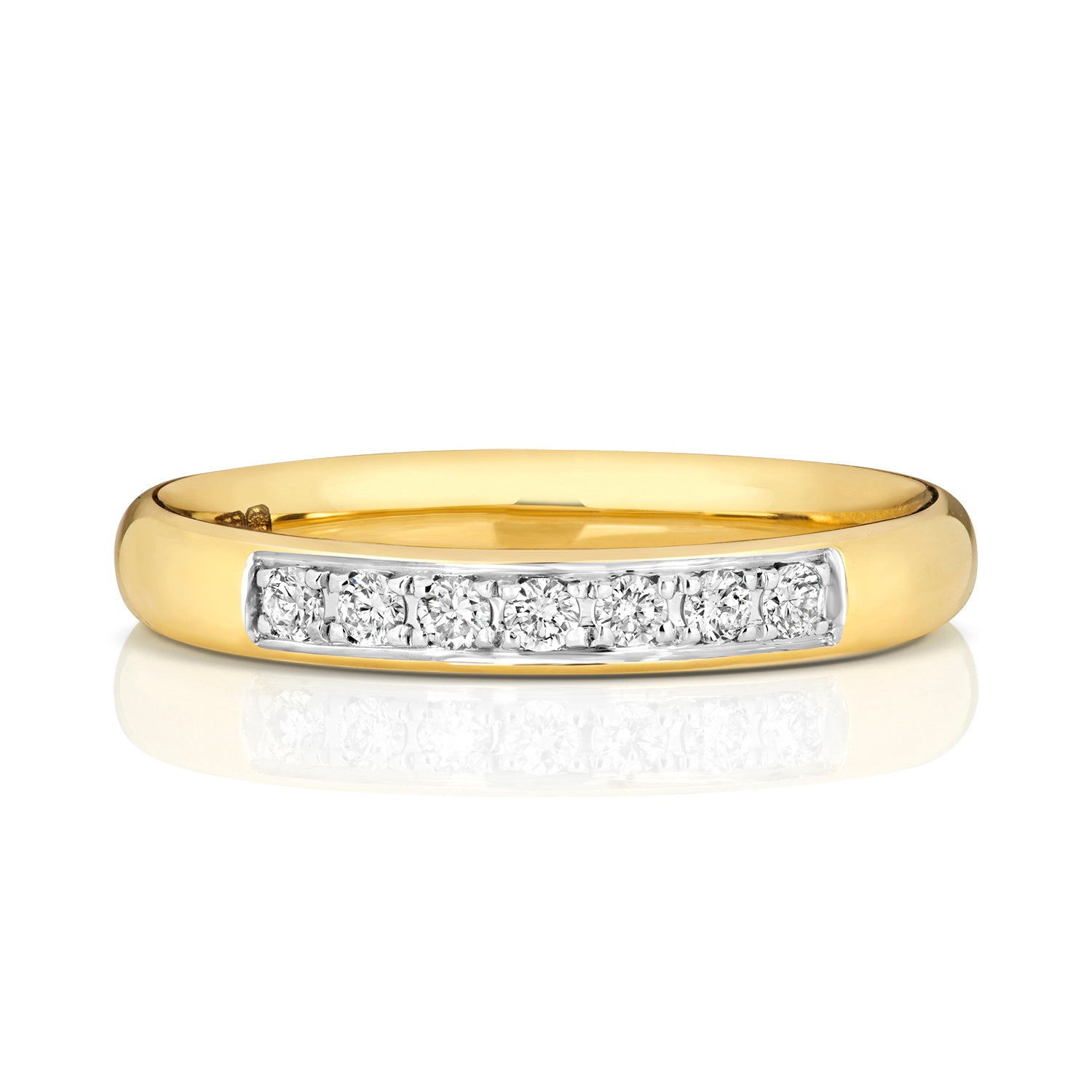 A front view of a yellow gold grain set diamond ring, highlighting the row of brilliant cut stones.
