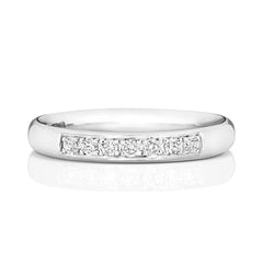 A front view of a white gold or platinum diamond wedding band with 25% diamond coverage.