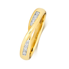 An angled side view of a 9ct yellow gold crossover ring, showcasing the smooth channel set diamonds within the twist.